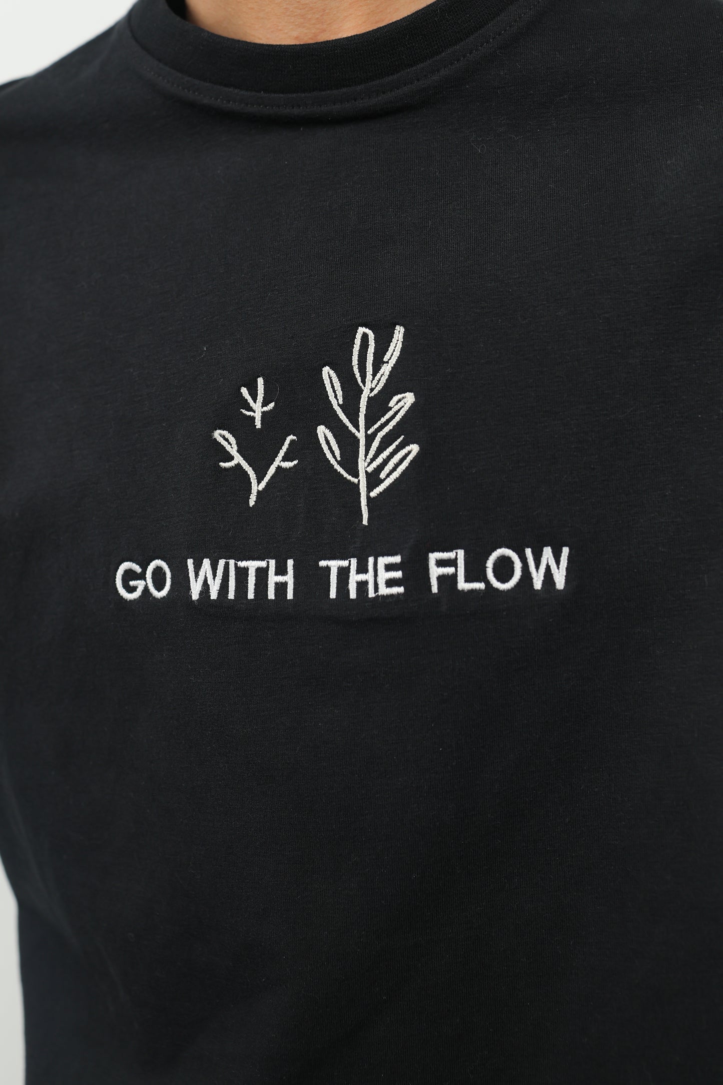 ELUX Go With The Flow Tee embroidery detail