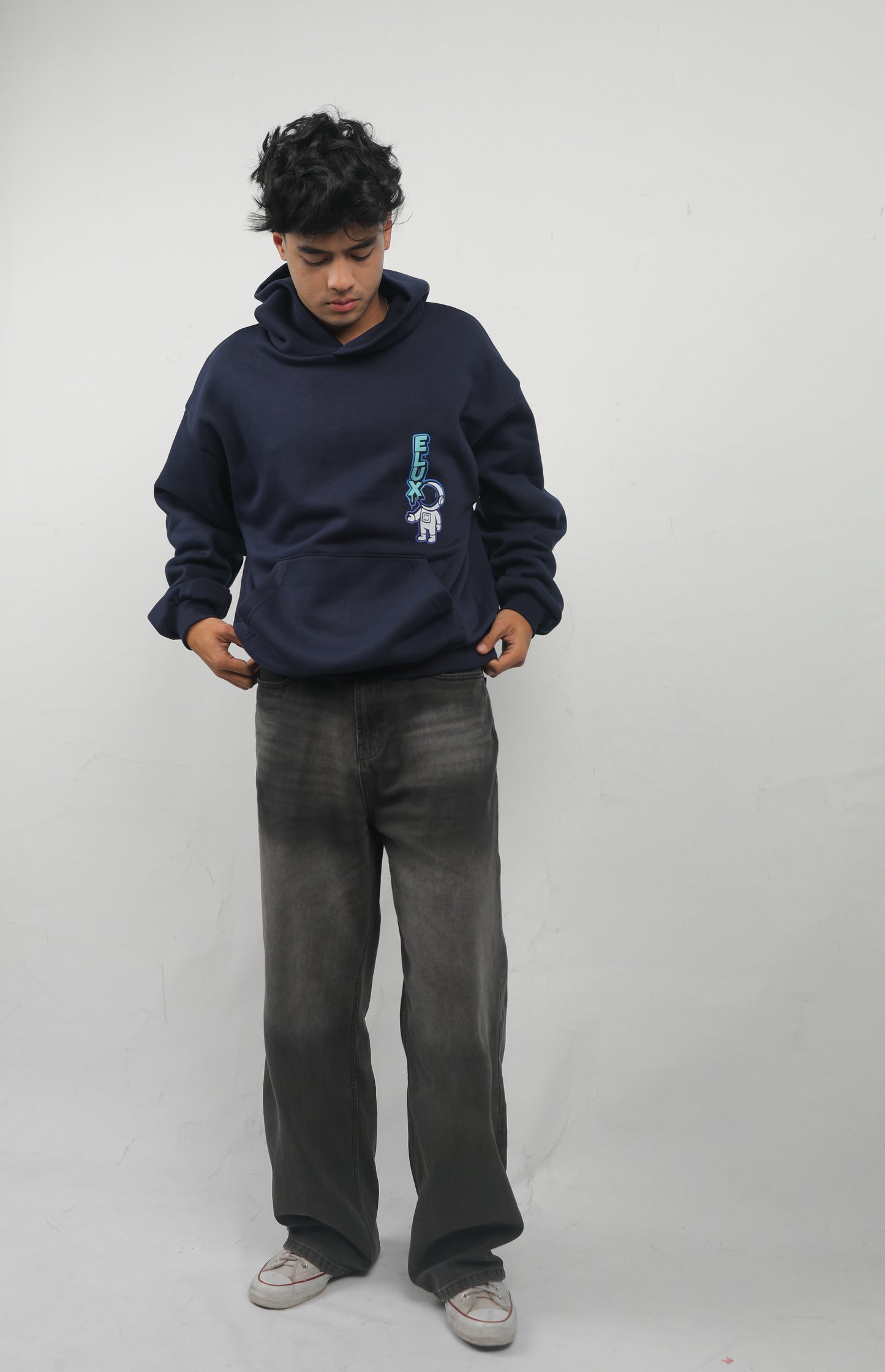 ELUX Astronaut Hoodie streetwear outfit indoor setting